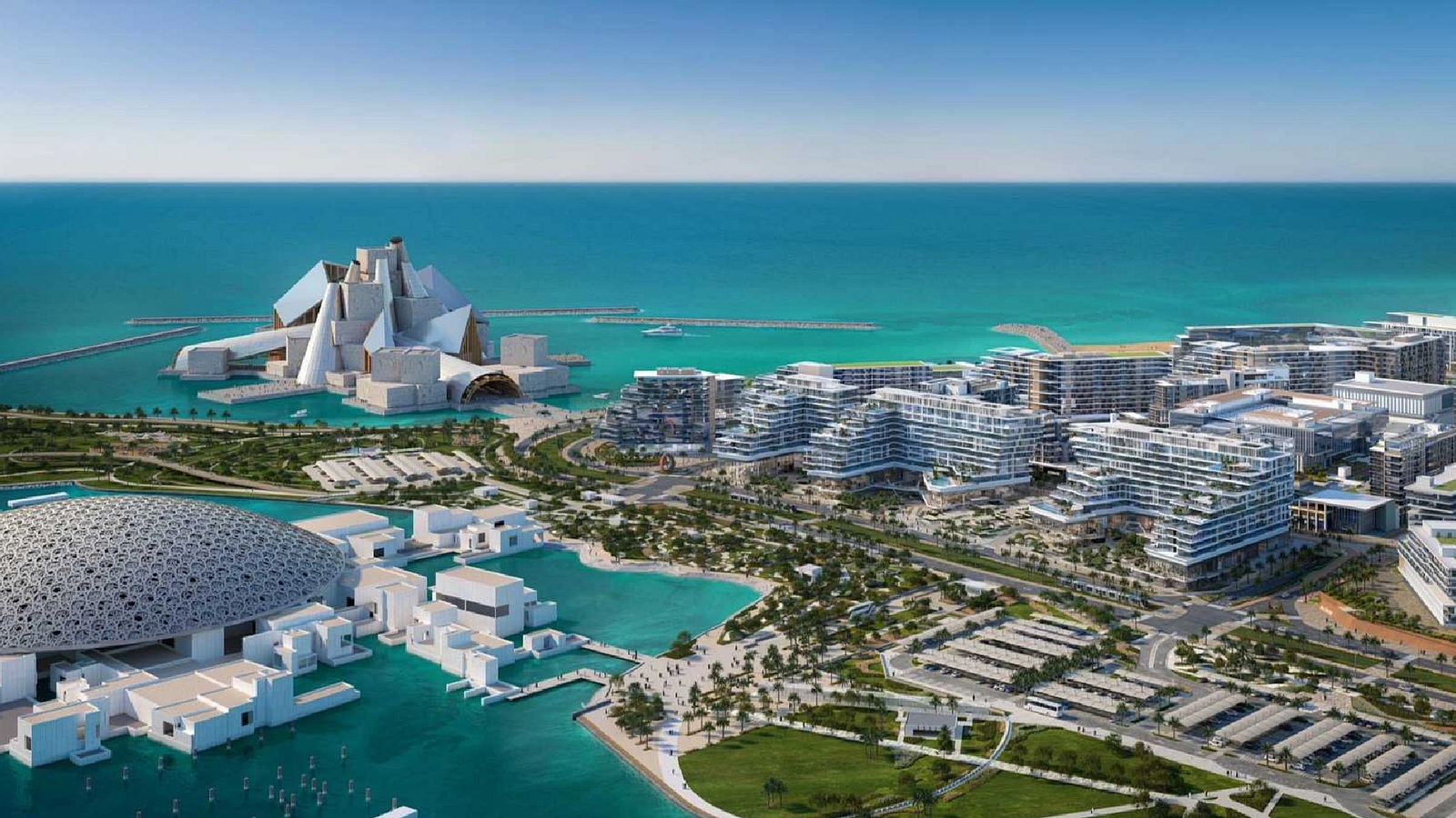 Panoramic view of a pristine white-sand coastline meeting the turquoise waters of the Arabian Gulf, framed by lush green landscaping.